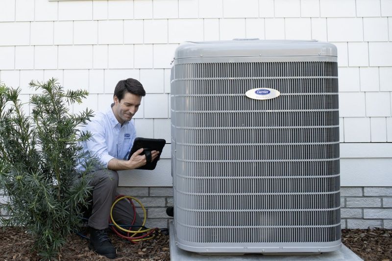 Man checks the status of an air conditioner