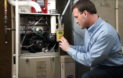Speir technician repairs a furnace. 