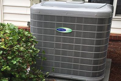 A heat pump outside a house.