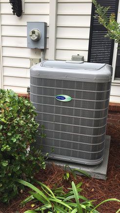 Carrier air conditioner outside a house