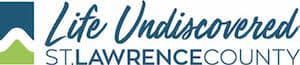 The logo for life uncovered st lawrence county is blue and green.