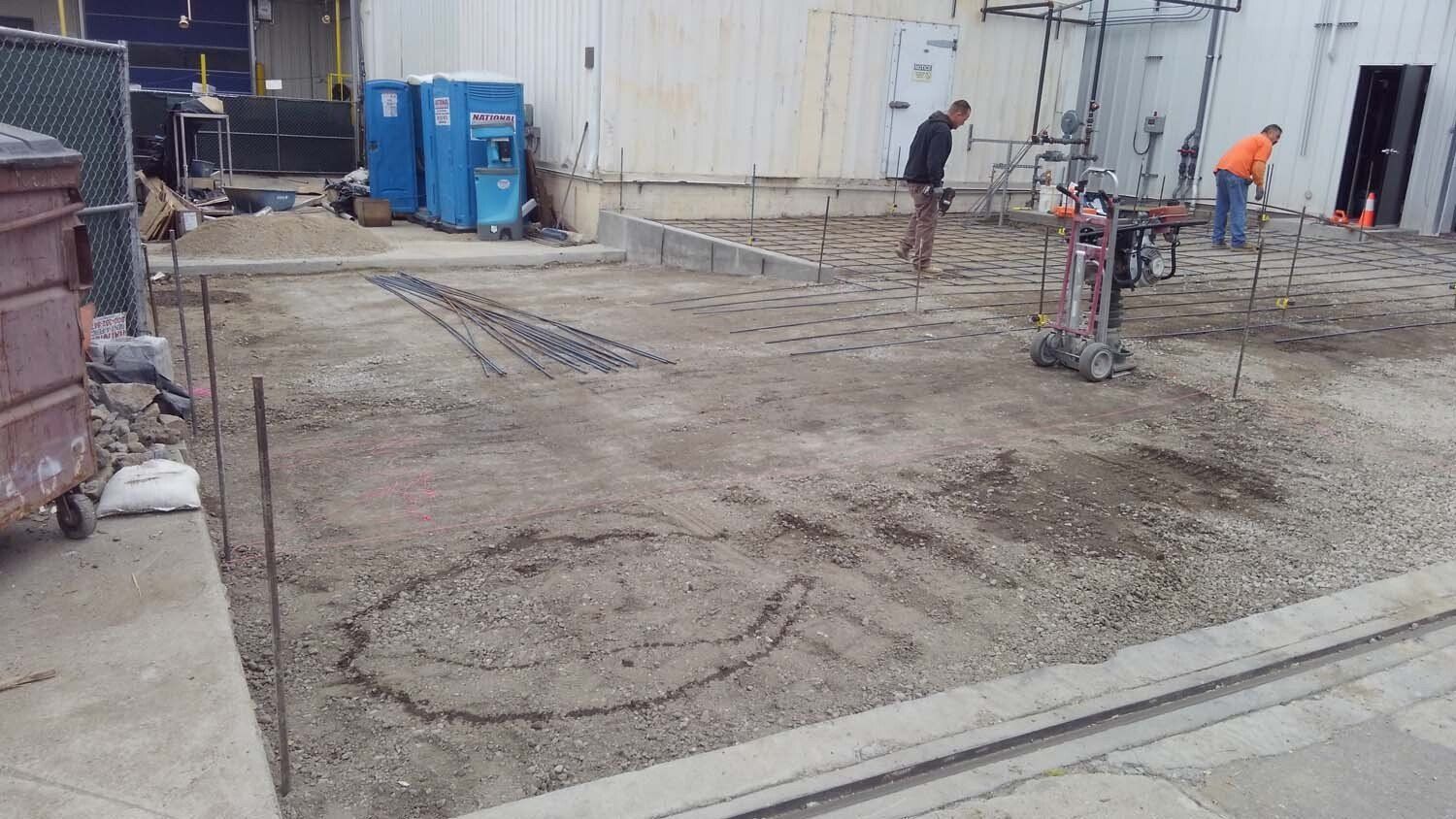 A group of construction workers are working on a construction site.