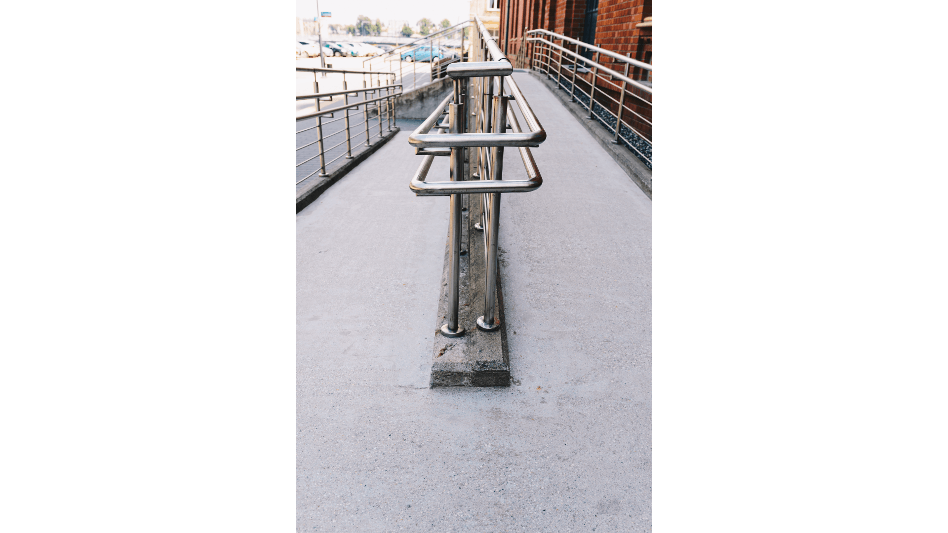 A metal railing on the side of a walkway