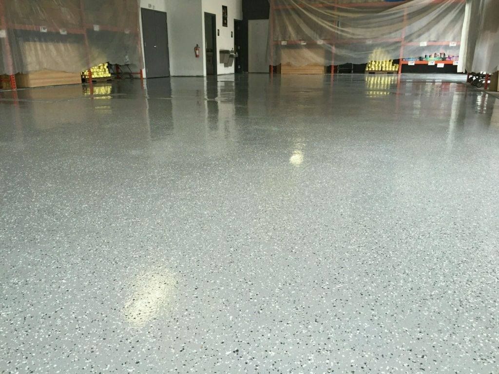 Gray epoxy garage floor with speckled flecks.