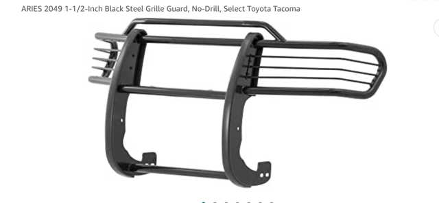 Side step on a gold truck, for easier access, parked near a curb.