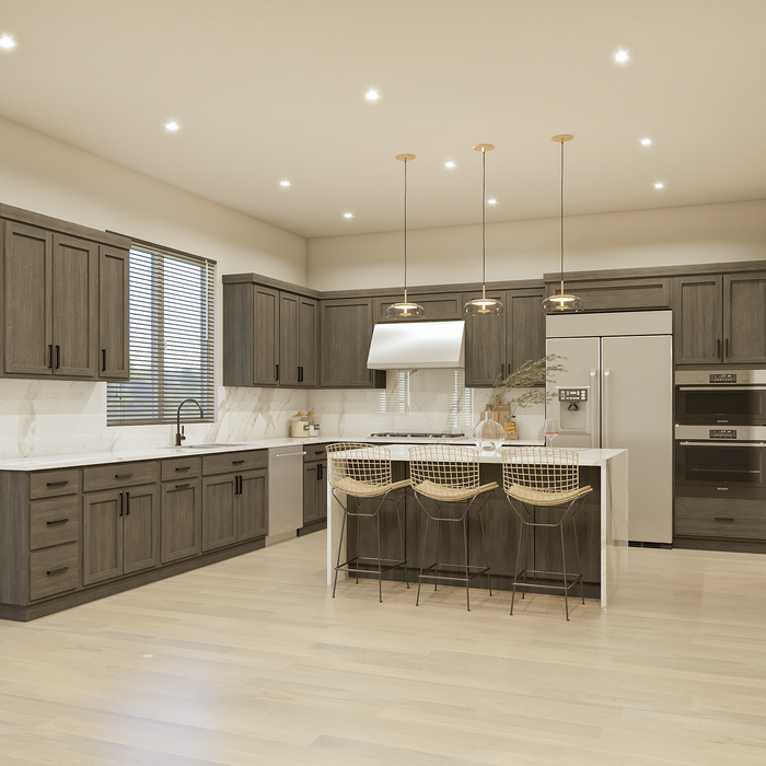 A kitchen with black and white cabinets and a wooden floor.