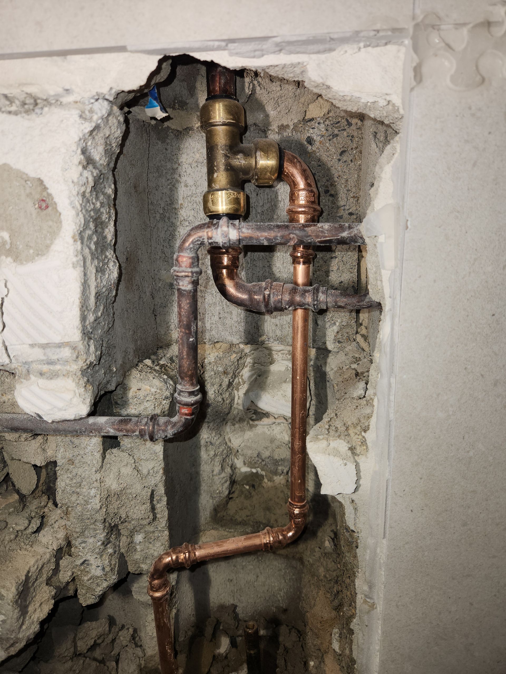 Copper Plumbing Pipes Connected With Brass Fittings Embedded — Kingdom Plumbing Services in Gordonvale, QLD
