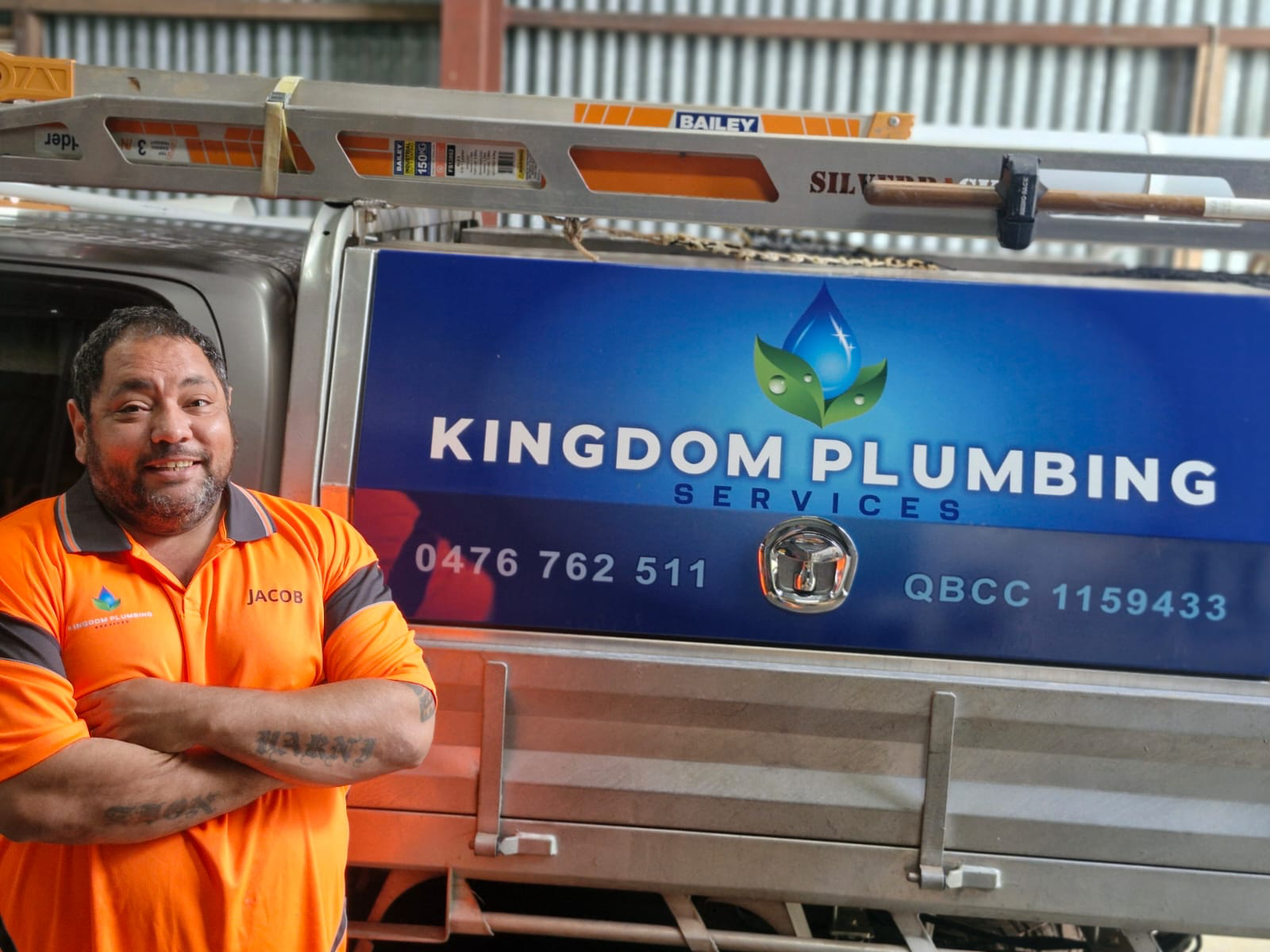 A Black Trailer With a Covered Storage Compartment — Kingdom Plumbing Services in Gordonvale, QLD
