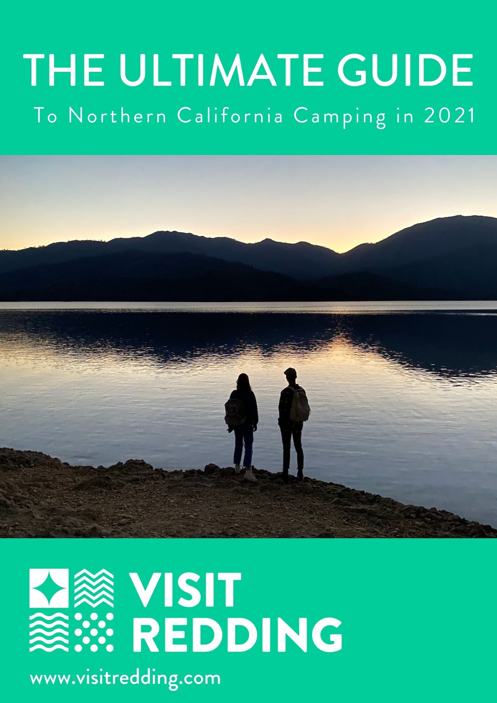 A couple stand on the edge of a lake surrounded by mountains during sunset as they talk about Northern California camping. Image overlaid with text that reads The Ultimate Guide to Northern California Camping in 2021 Visit Redding.