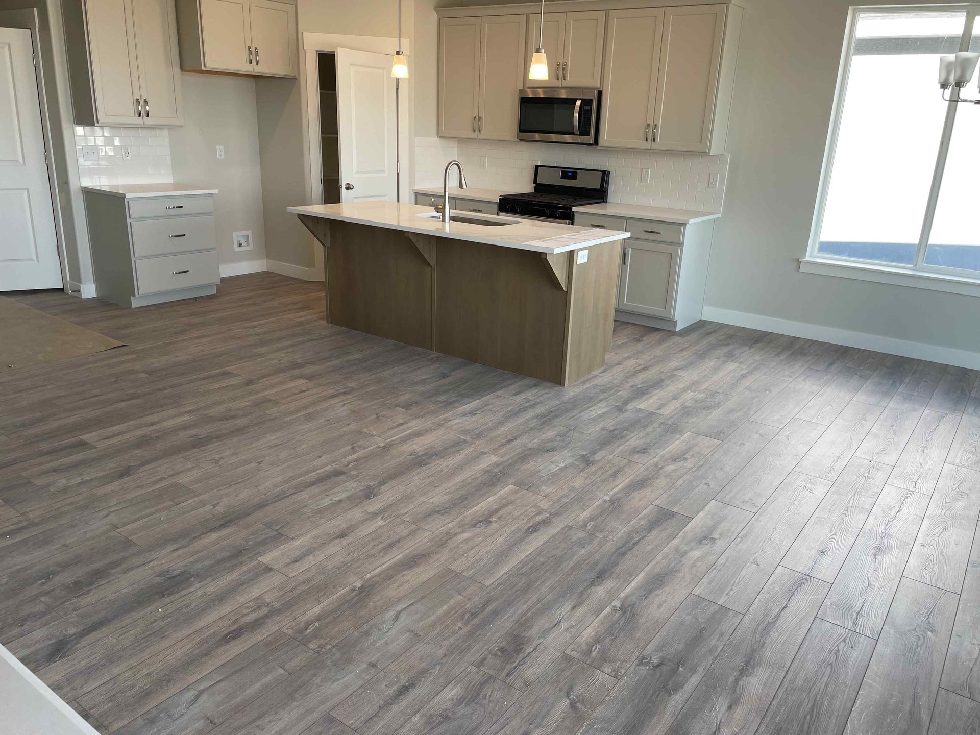 A kitchen with a large island in the middle of the room.