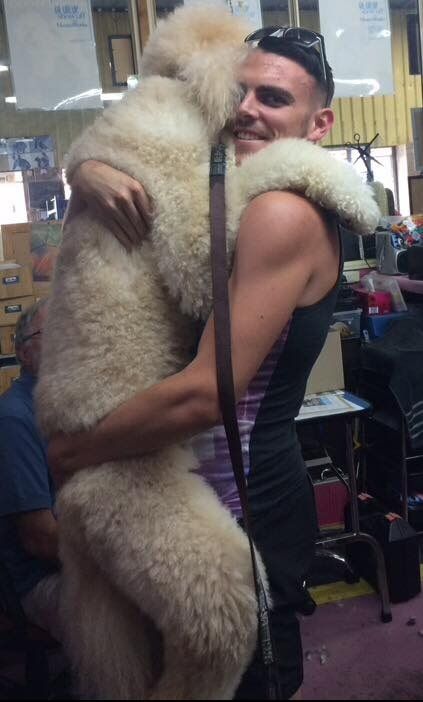 Men hugs dog 2 — Dogoverboard in Adamstown, NSW