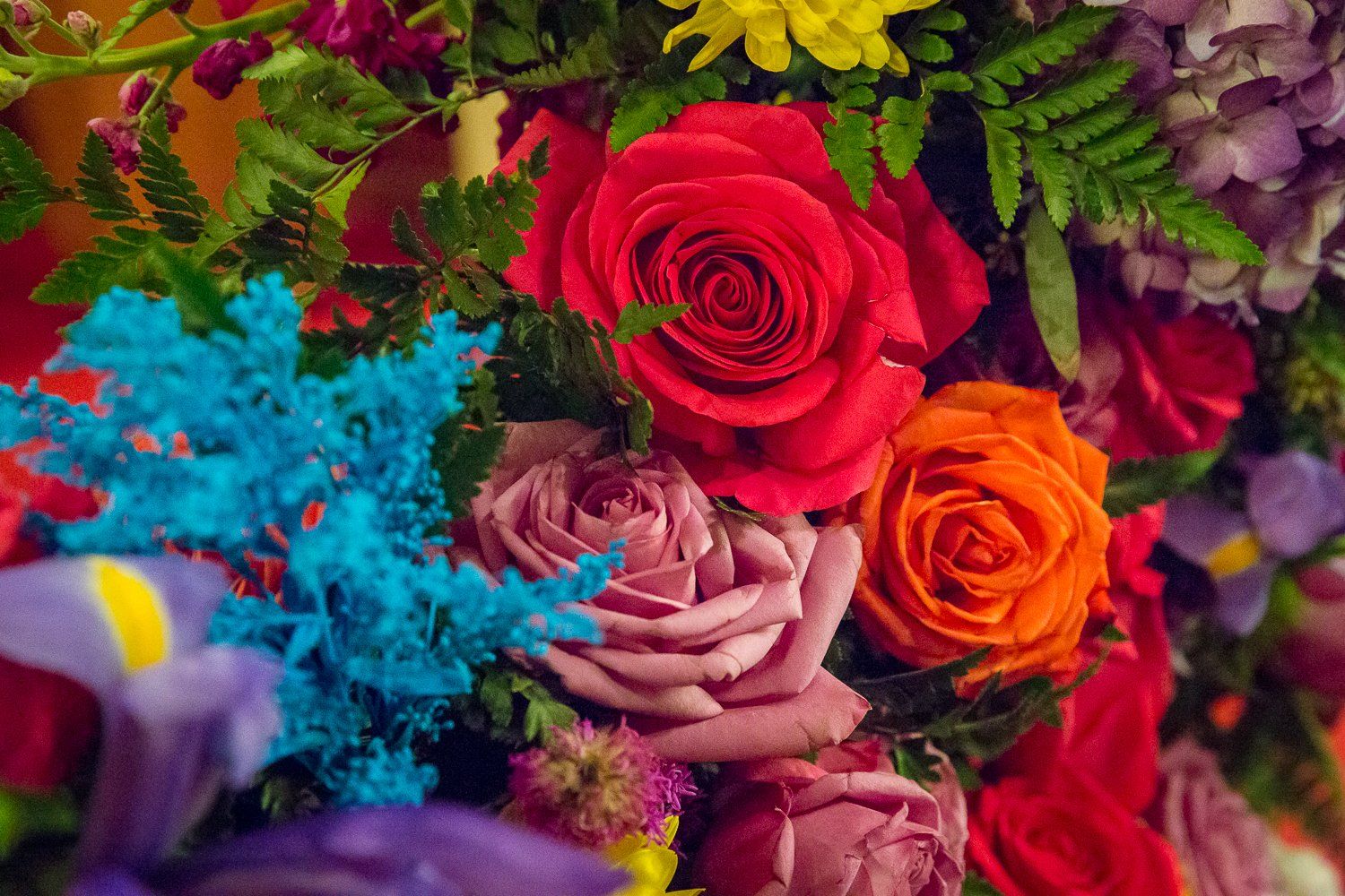 There are many different types of flowers in this bouquet.