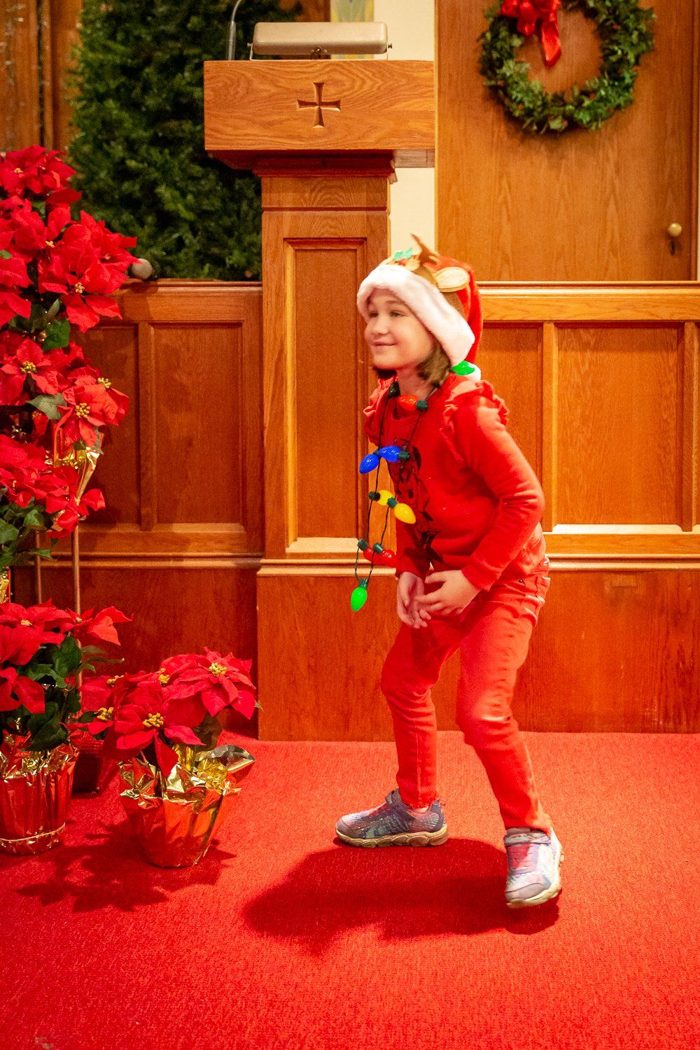 A girl acting in the Christmas pageant.