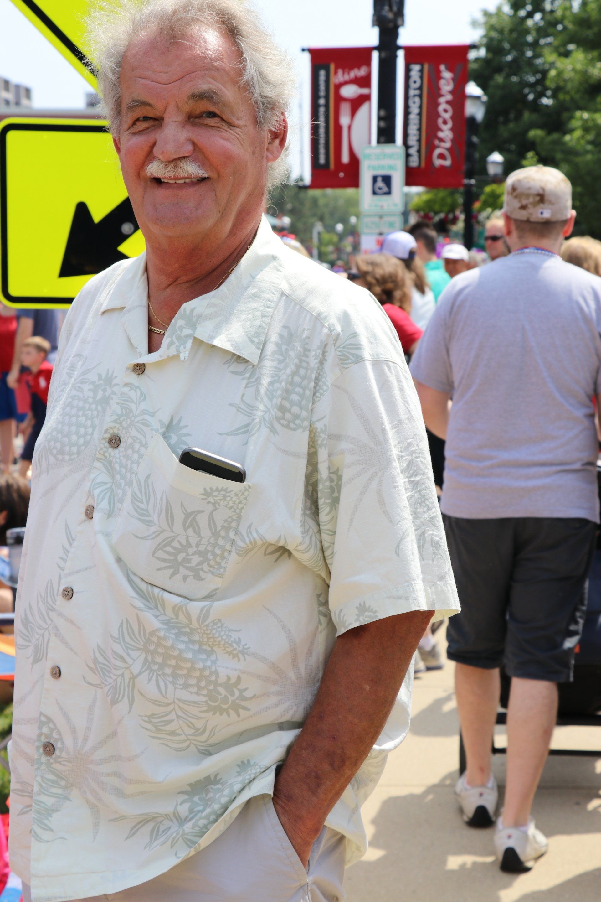 A man standing in front of a sign that says duchess
