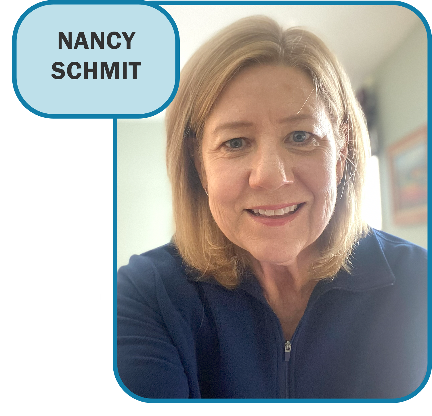 Nancy schmidt is smiling in front of a red door