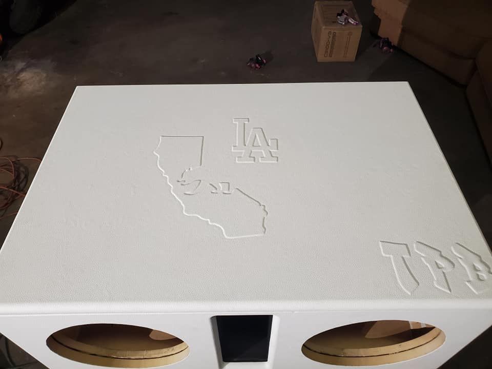 White speaker box with cutouts of California and 
