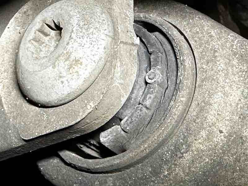 A close up of a metal object with a hole in it.