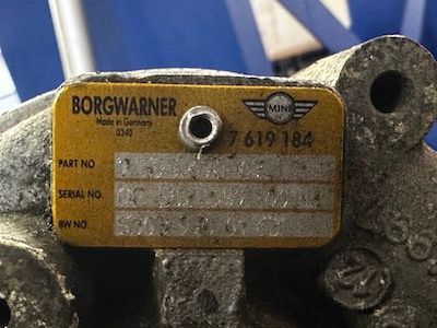 A piece of metal with a label that says borgwarner on it