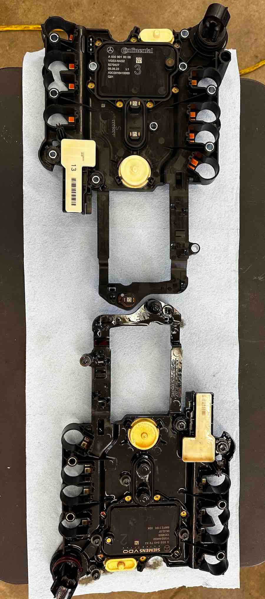 A piece of electronic equipment is sitting on top of a towel on a table.