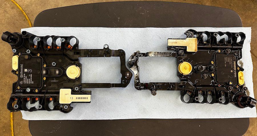 A motherboard is sitting on a piece of paper on a table.