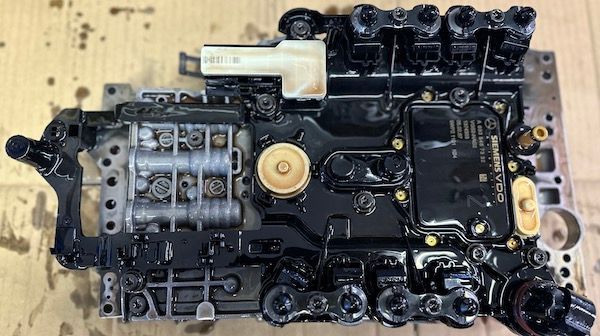 A piece of machinery is sitting on a wooden table.