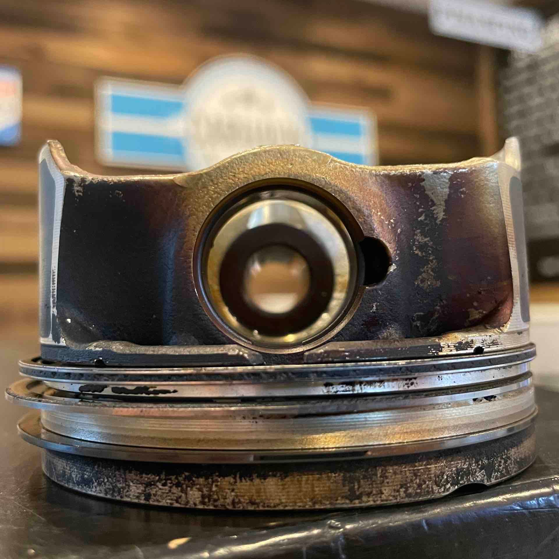 A close up of a piston with a hole in it on a table.