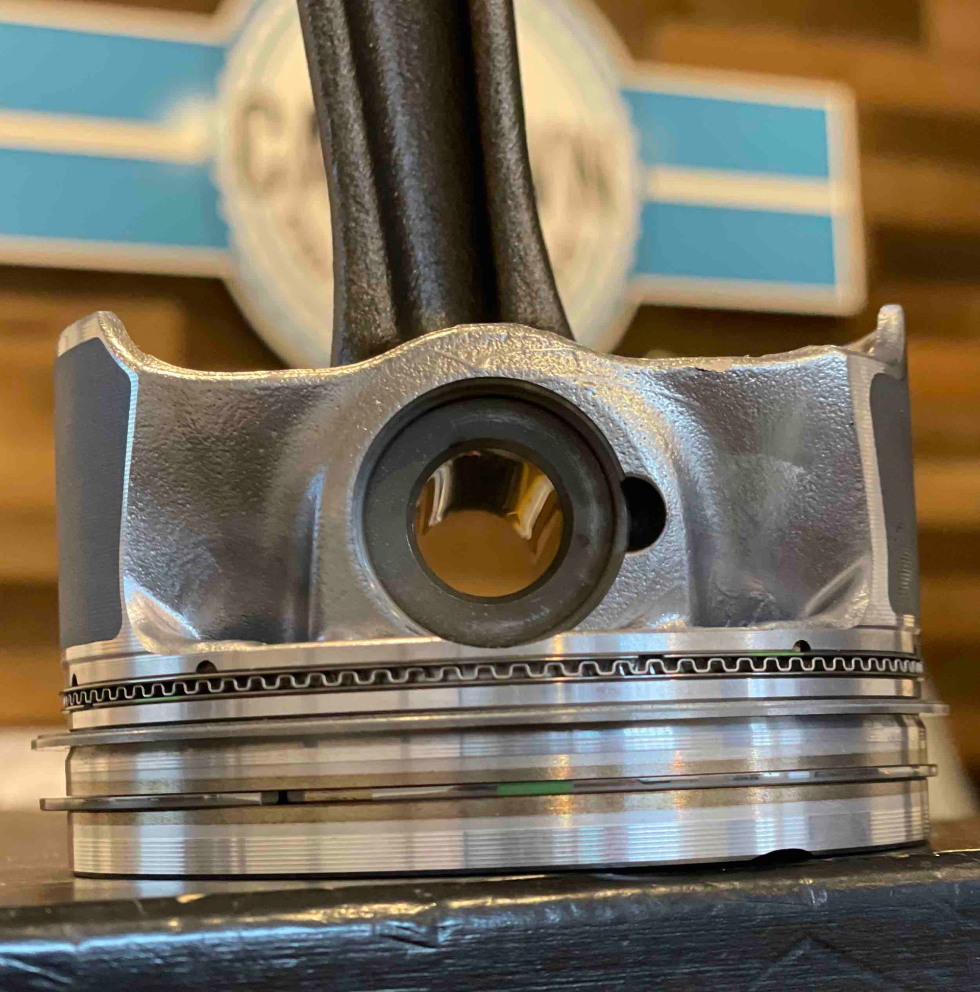 A close up of a piston with a hole in it