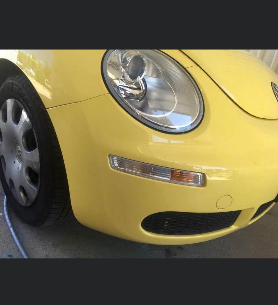 A Close Up Of The Front Of A Yellow Car — Rapid Auto Refinish in Toowoomba, QLD 