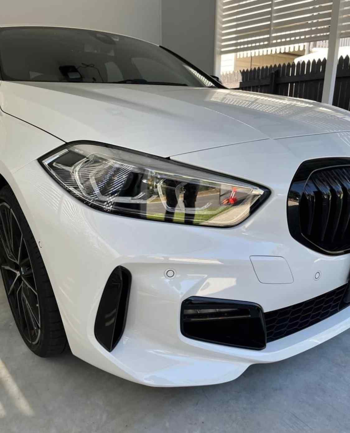 A White Bmw 1 Series Is Parked In A Garage  — Rapid Auto Refinish in Toowoomba, QLD 