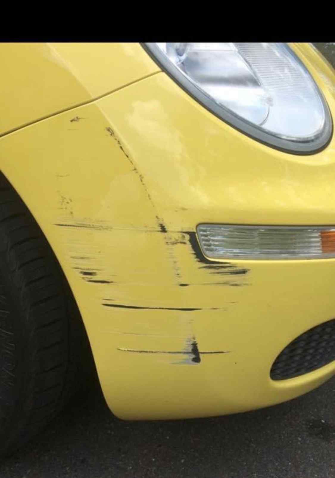 A Yellow Car Has A Scratch On The Front Bumper  — Rapid Auto Refinish in Toowoomba, QLD 
