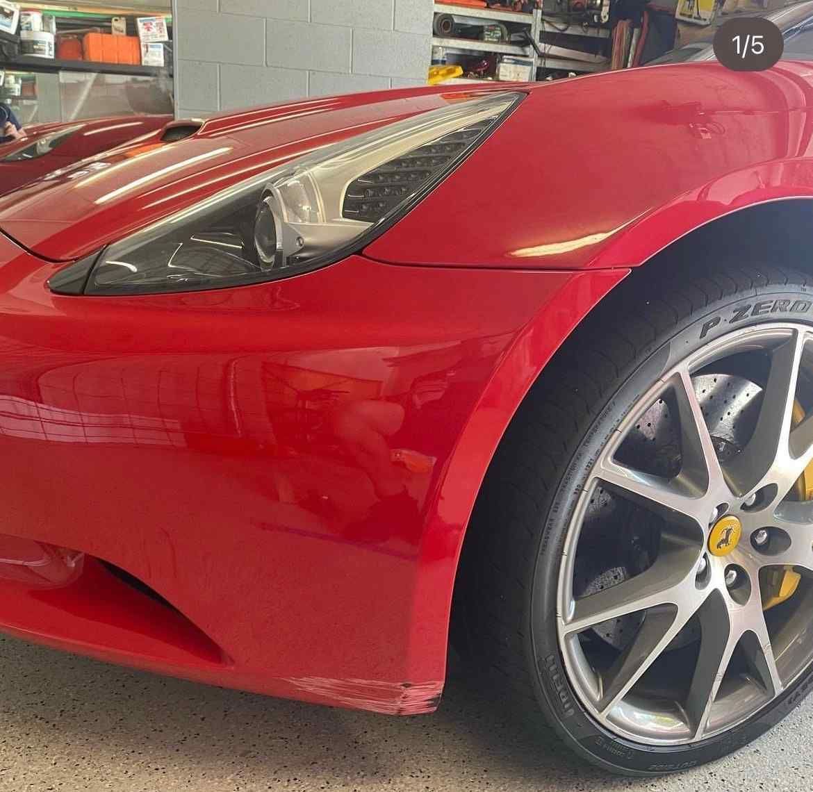 A Red Sports Car Is Parked In A Garage  — Rapid Auto Refinish in Toowoomba, QLD 