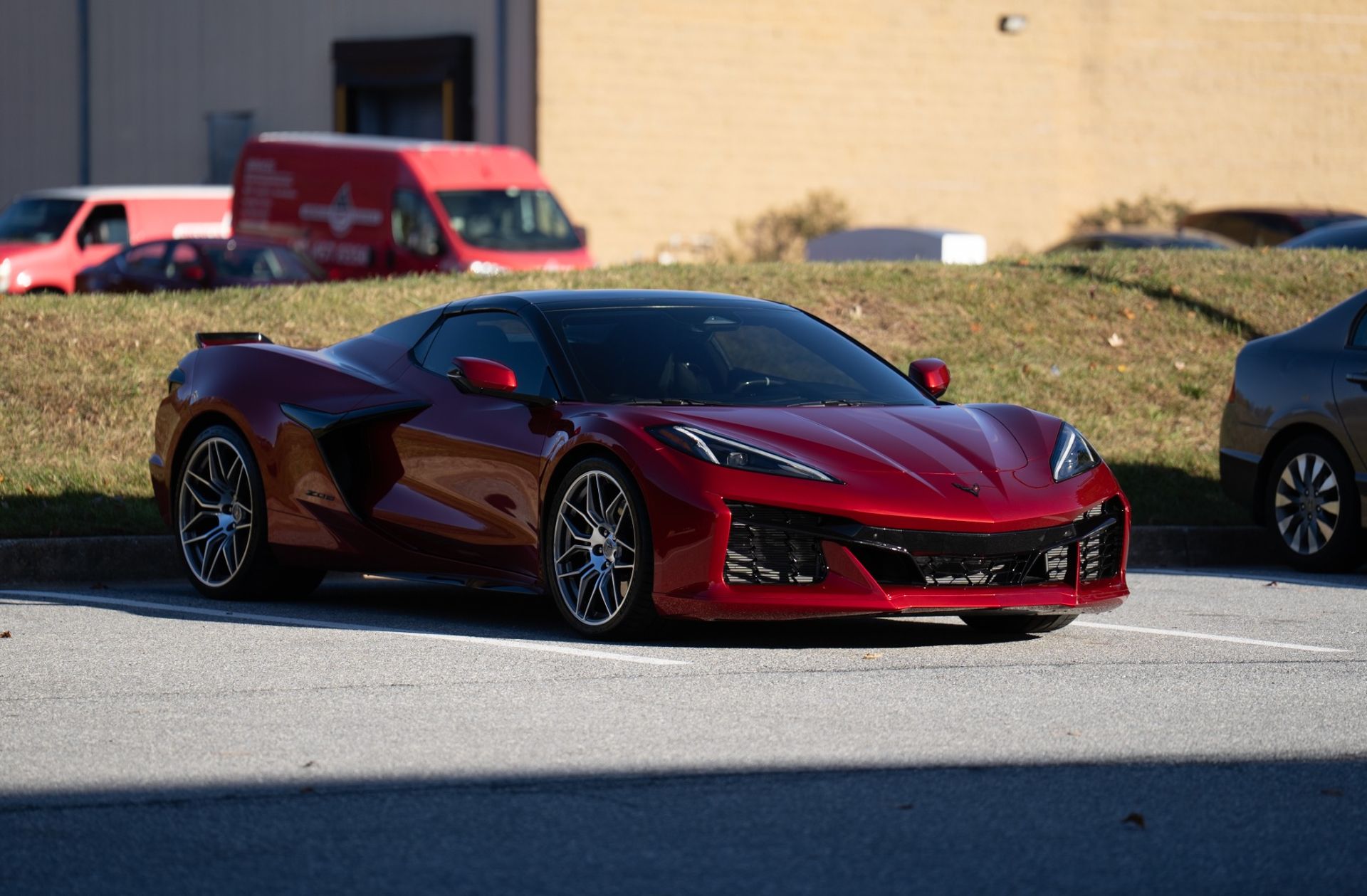A white Lamborghini Urus SUV parked inside a workshop with Ceramic Pro branding on the wall.