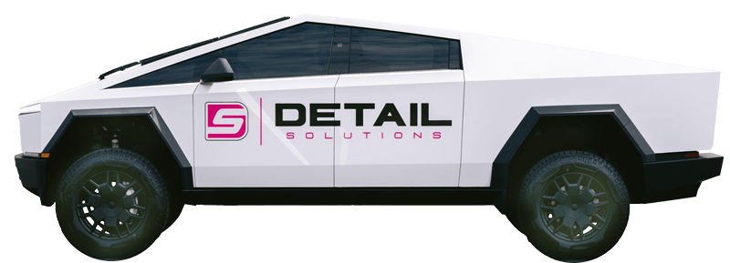 A white truck with the word detail on the side