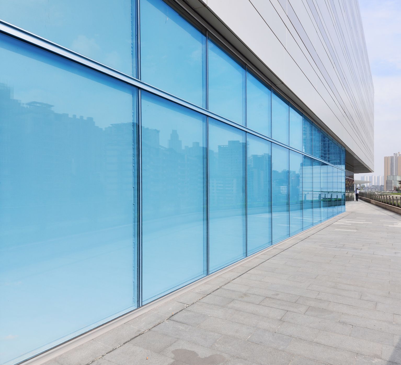 A large building with a lot of blue windows