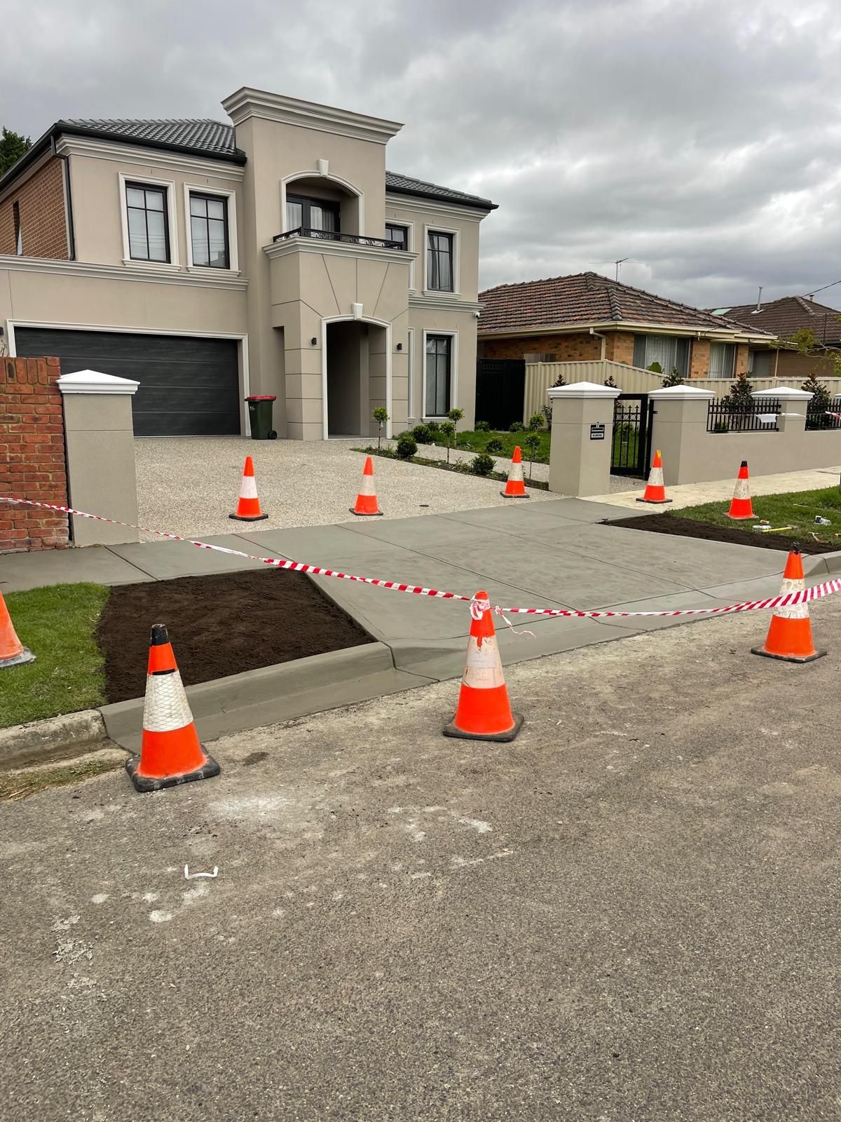 A house with a lot of traffic cones in front of it.