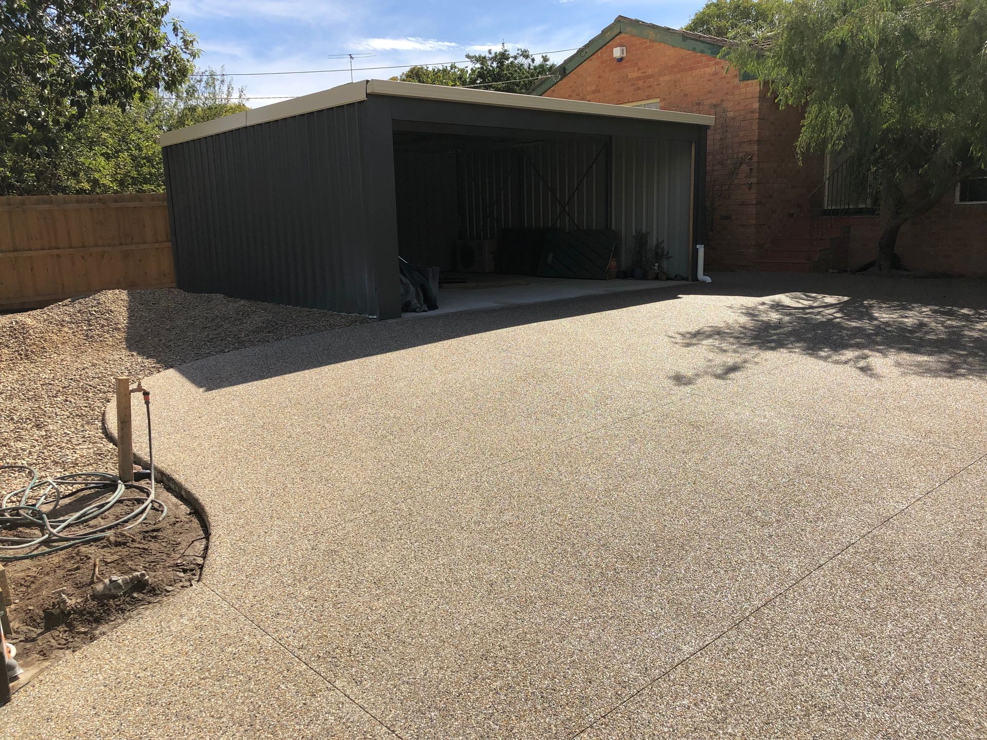 A bicycle is parked in front of a garage.