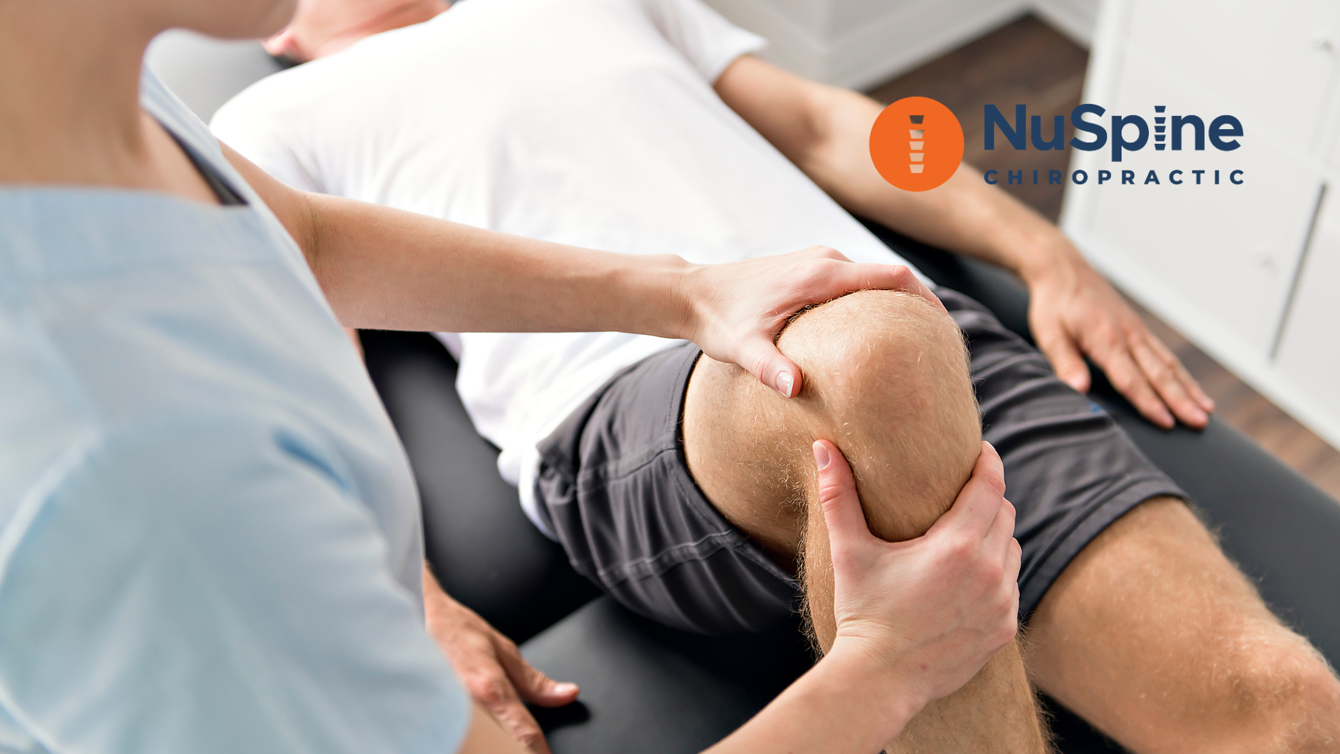 A man is getting his knee examined by a nurse.