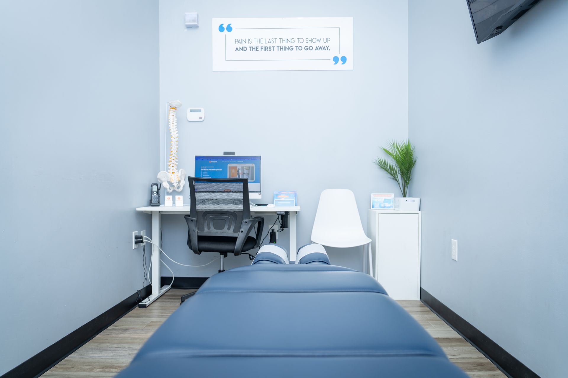 A room with a bed , desk and chair in it.