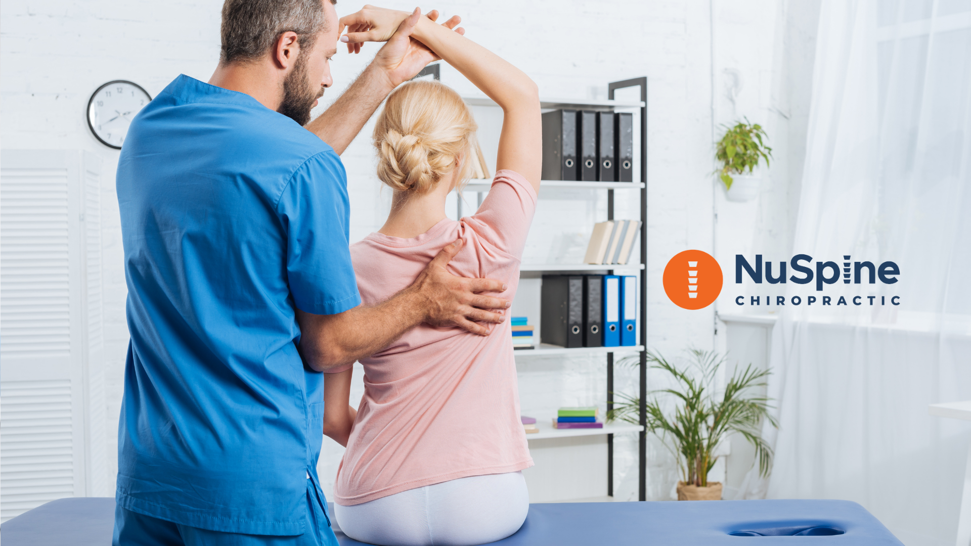 Chiropractor adjusting a patient's back in a clinic.