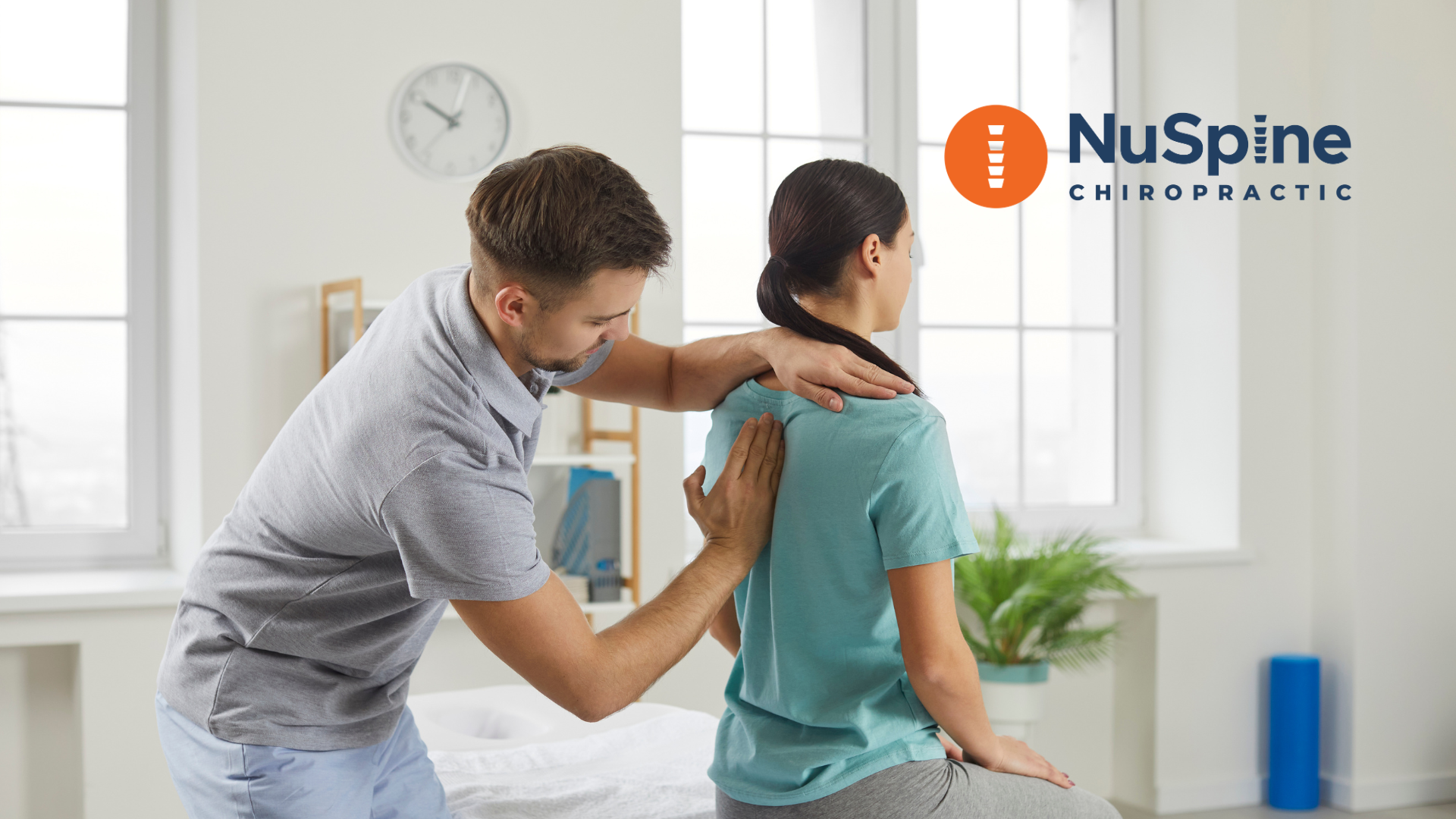 A man is giving a woman a massage in a room.