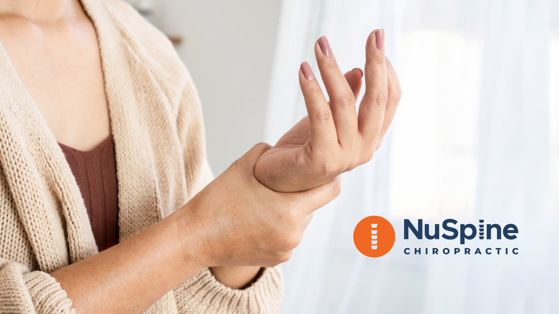 Woman holding her wrist, likely in pain. NuSpine Chiropractic logo in the corner.