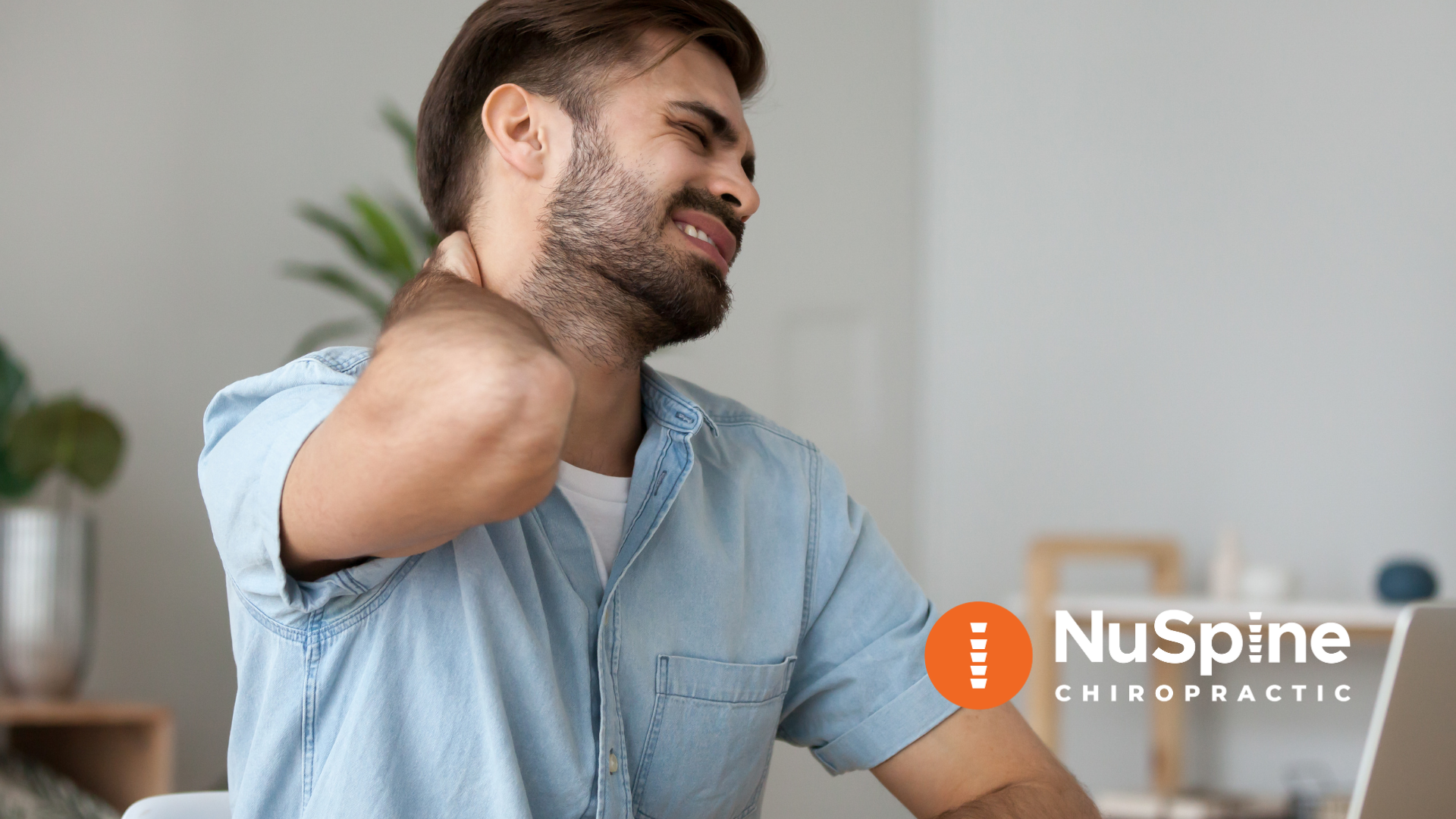 Man with neck pain at desk, likely related to computer use. NuSpine Chiropractic logo.