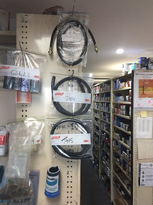 A Bunch of Hose Hanging on A Wall in A Store — Canberra Brake & Clutch Service In ACT, 2609