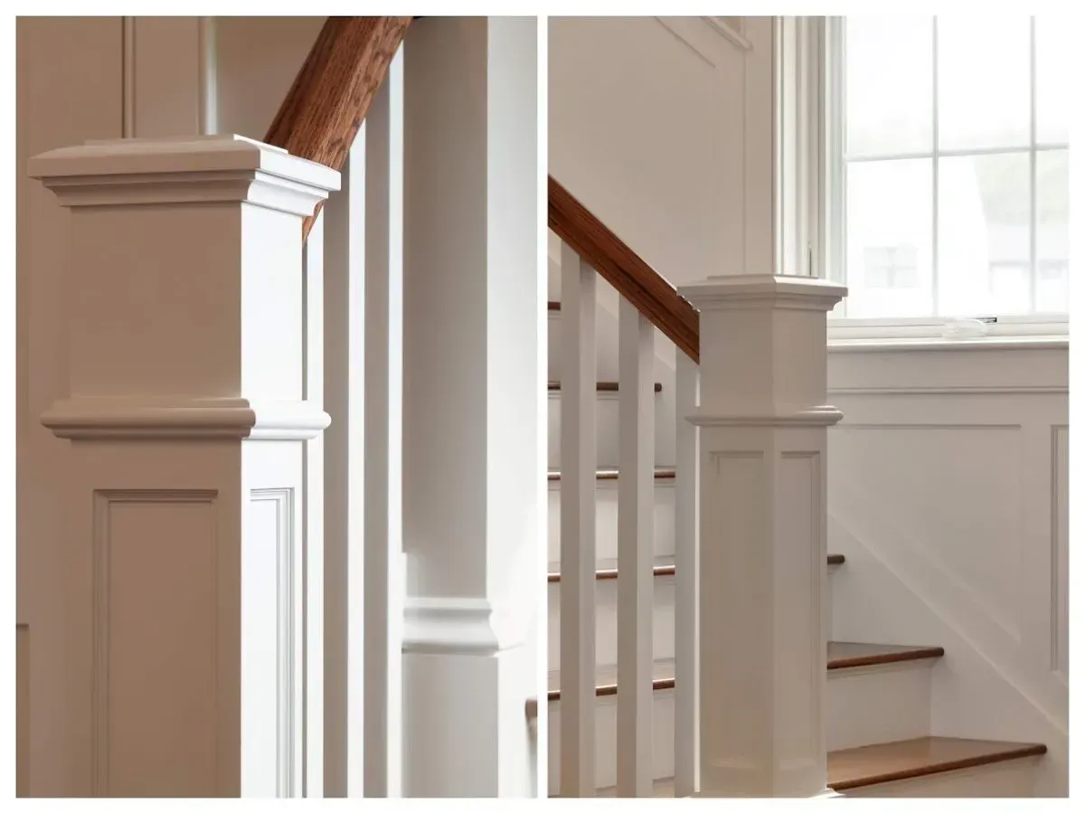 Custom-built white stairway with natural wood banister.