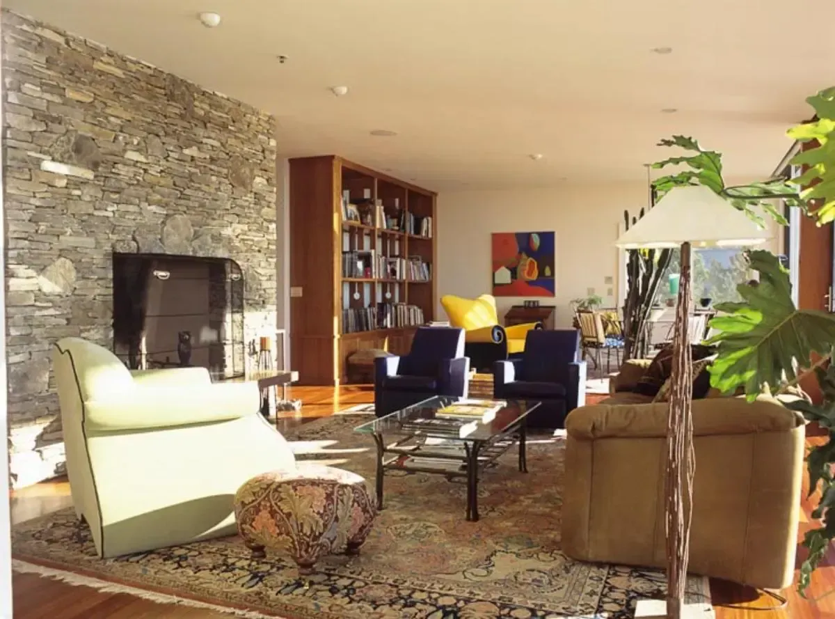 A living room filled with furniture and a fireplace