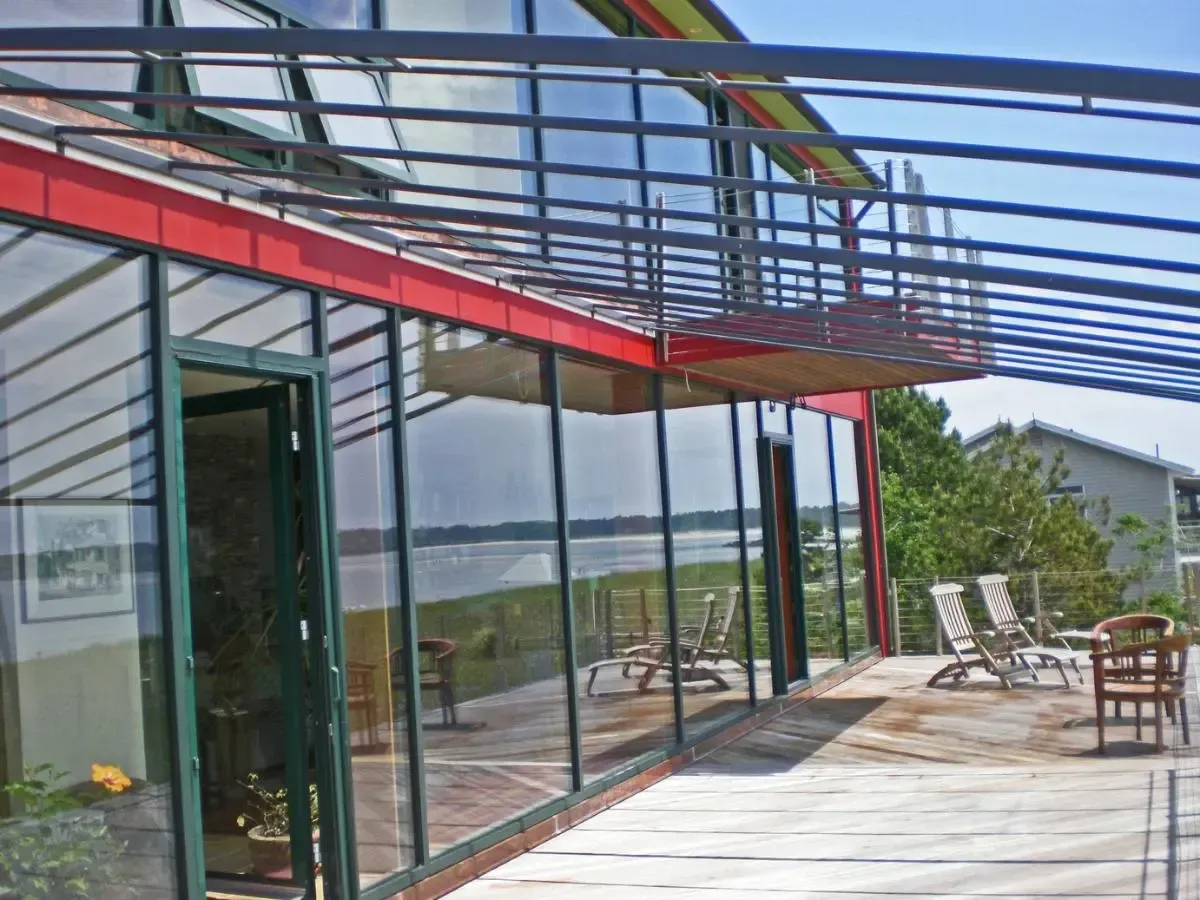 A large house with lots of windows and a balcony