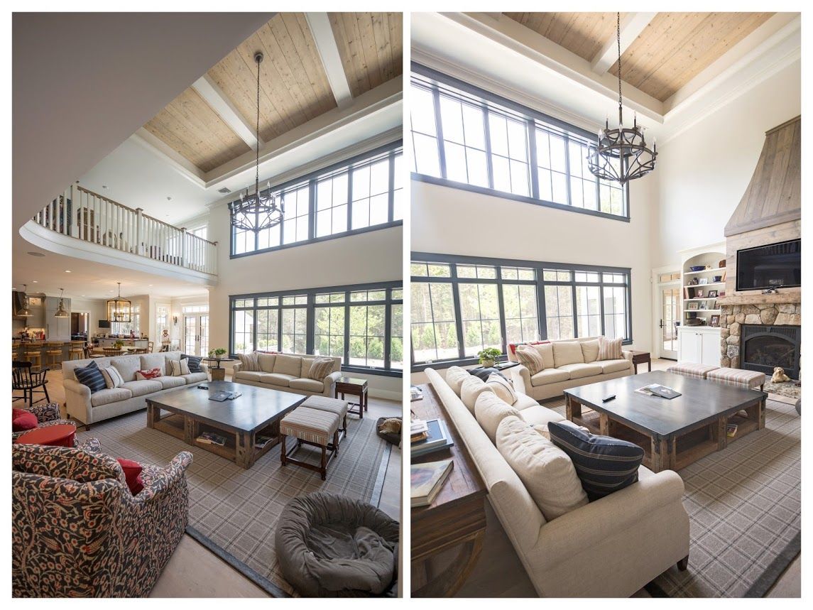 A living room with a lot of furniture and a fireplace.