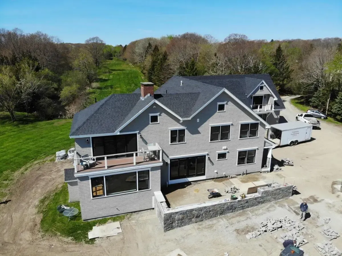 An aerial view of a large house with a lot of windows