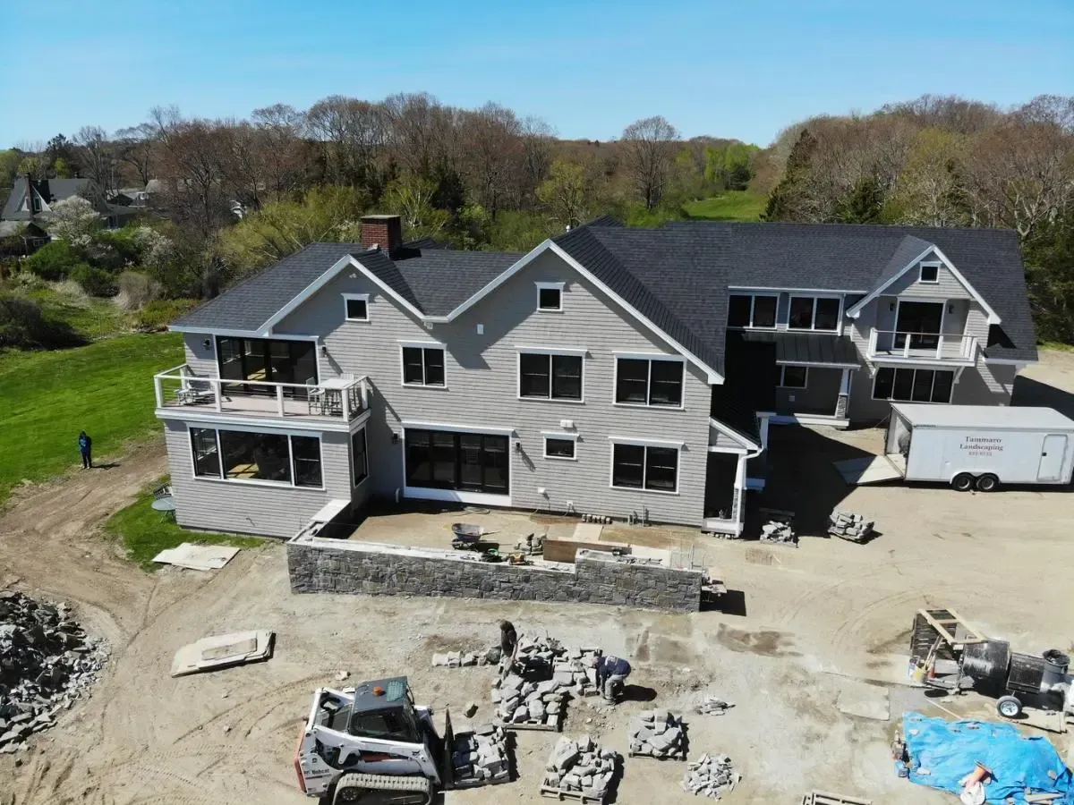 An aerial view of a large house under construction