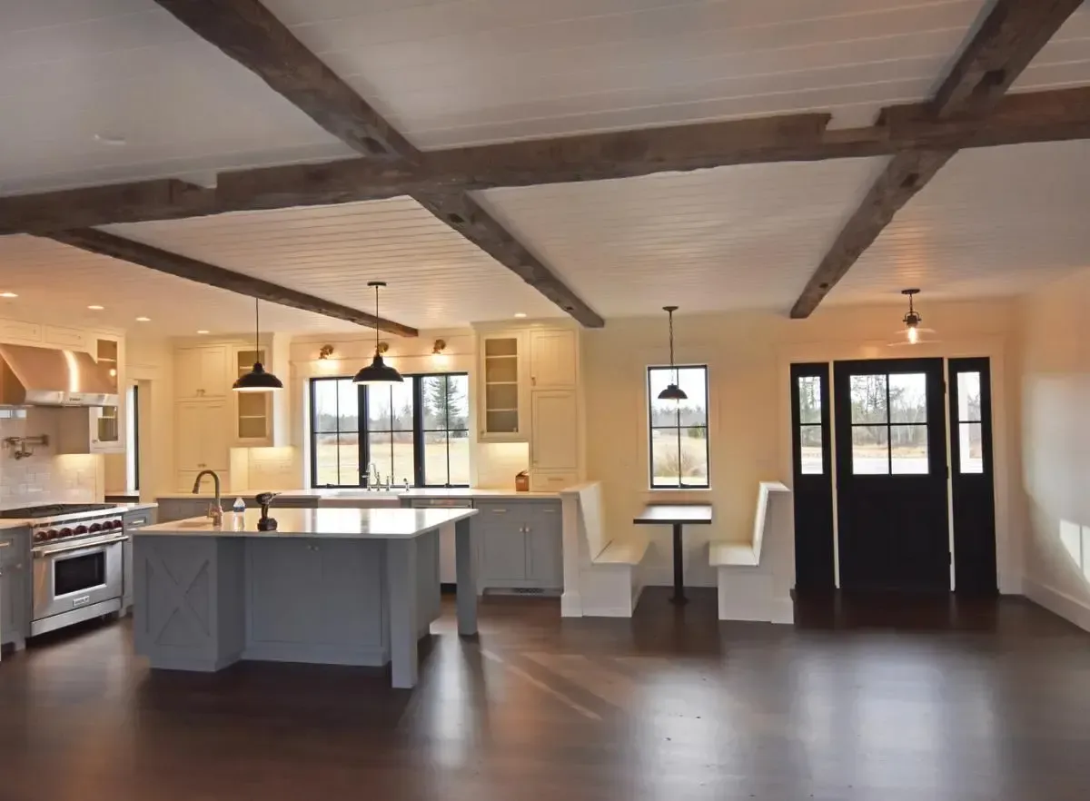 A kitchen with a large island and a table